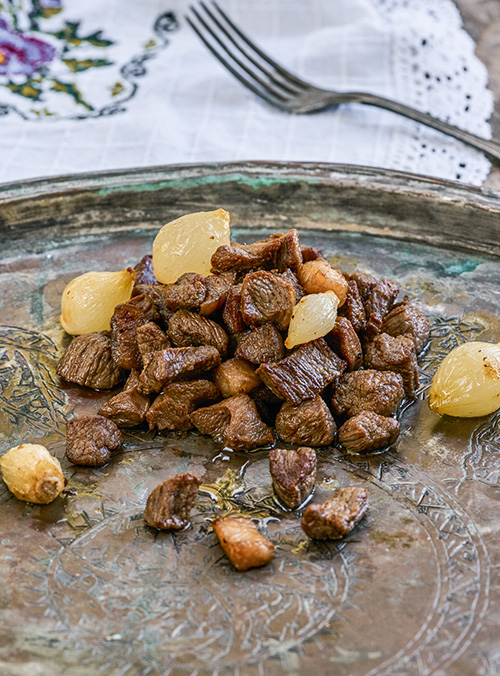 Diced Lamb fried on iron plate